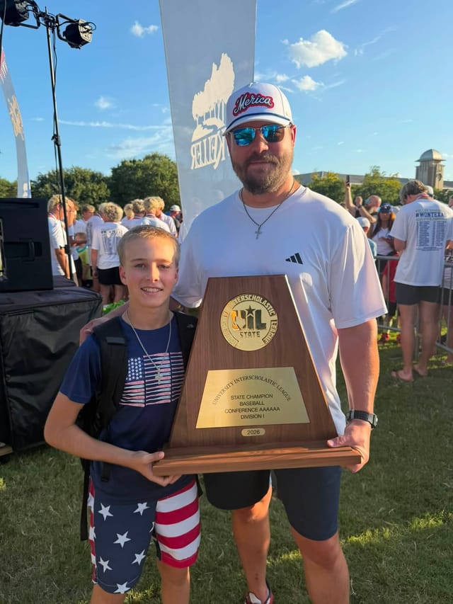 Chris and son with State Champion trophy